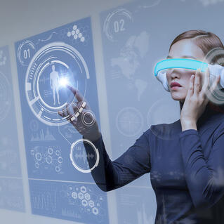 lady using a VR device and pointing at a head mount display