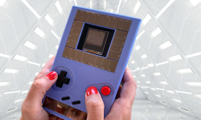 GameBoy with Apollo3 Blue with tech background