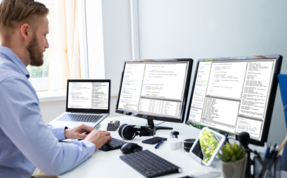 Man working from home with two monitors