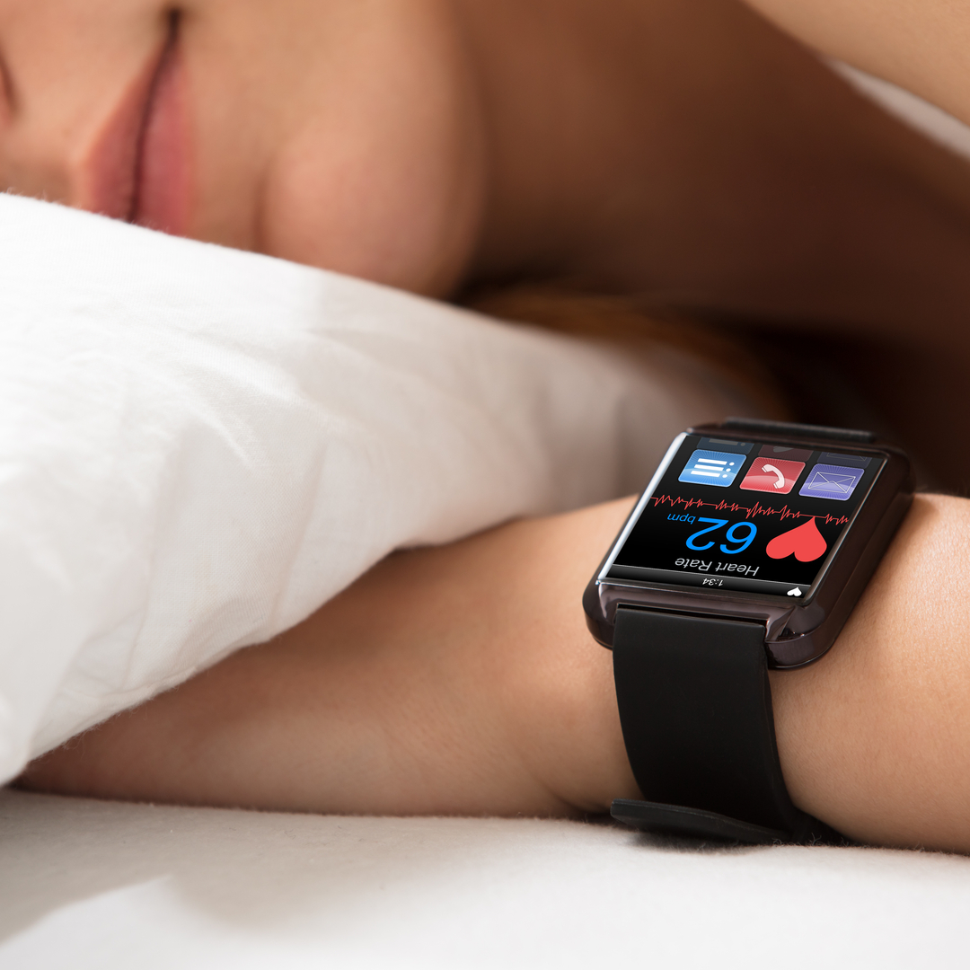 Smartwatch Showing Heartbeat Rate On Sleeping Woman's Hand