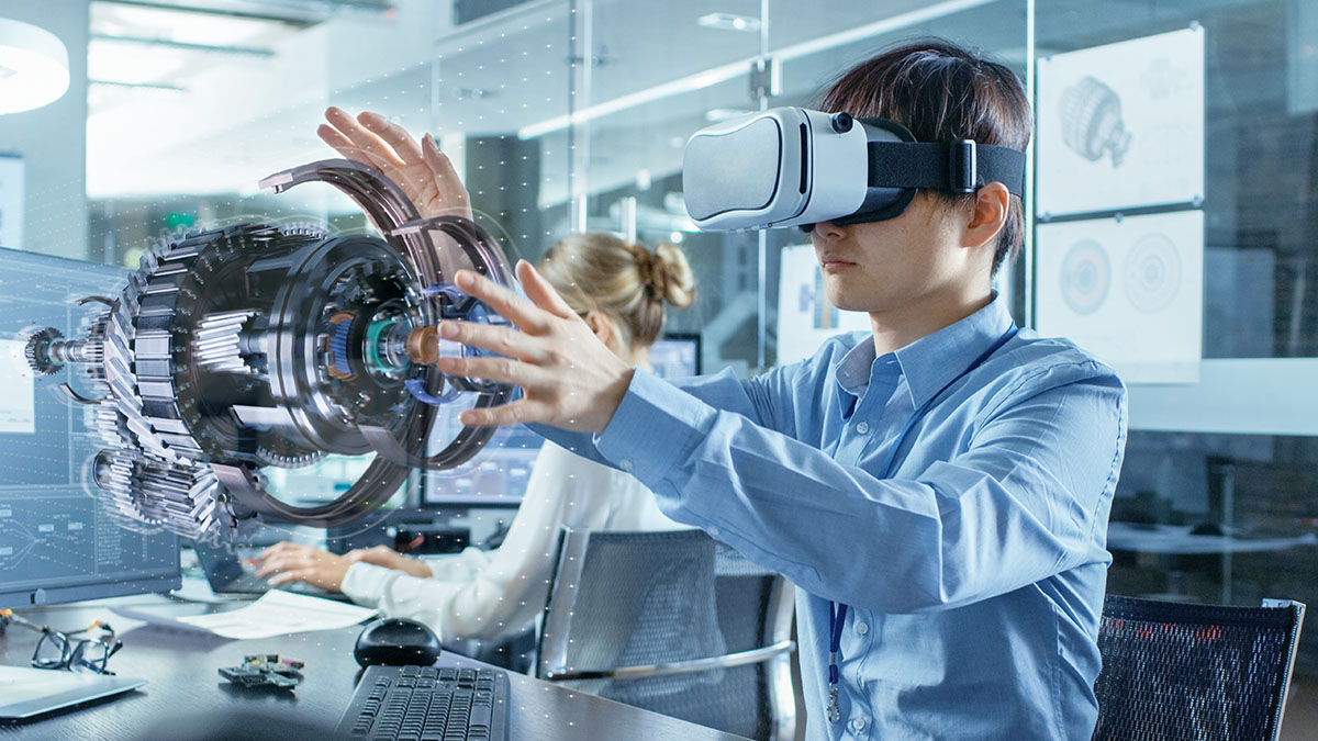 Engineer wearing Virtual Reality Headset Works with 3D Model Hologram Visualization