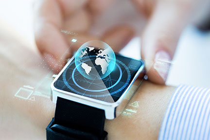 Close-up of hand with globe hologram on smartwatch