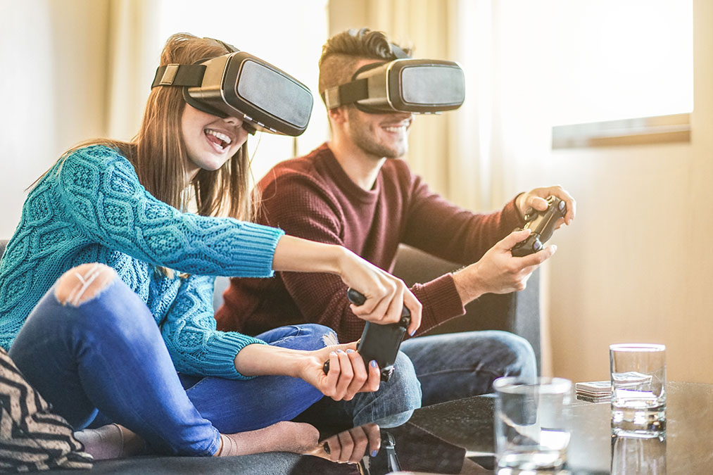 friends playing video games wearing virtual-reality glasses