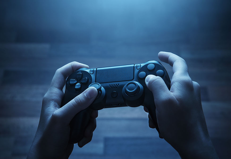 Man holding wireless gaming controller
