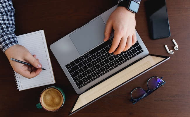 man working from home with laptop