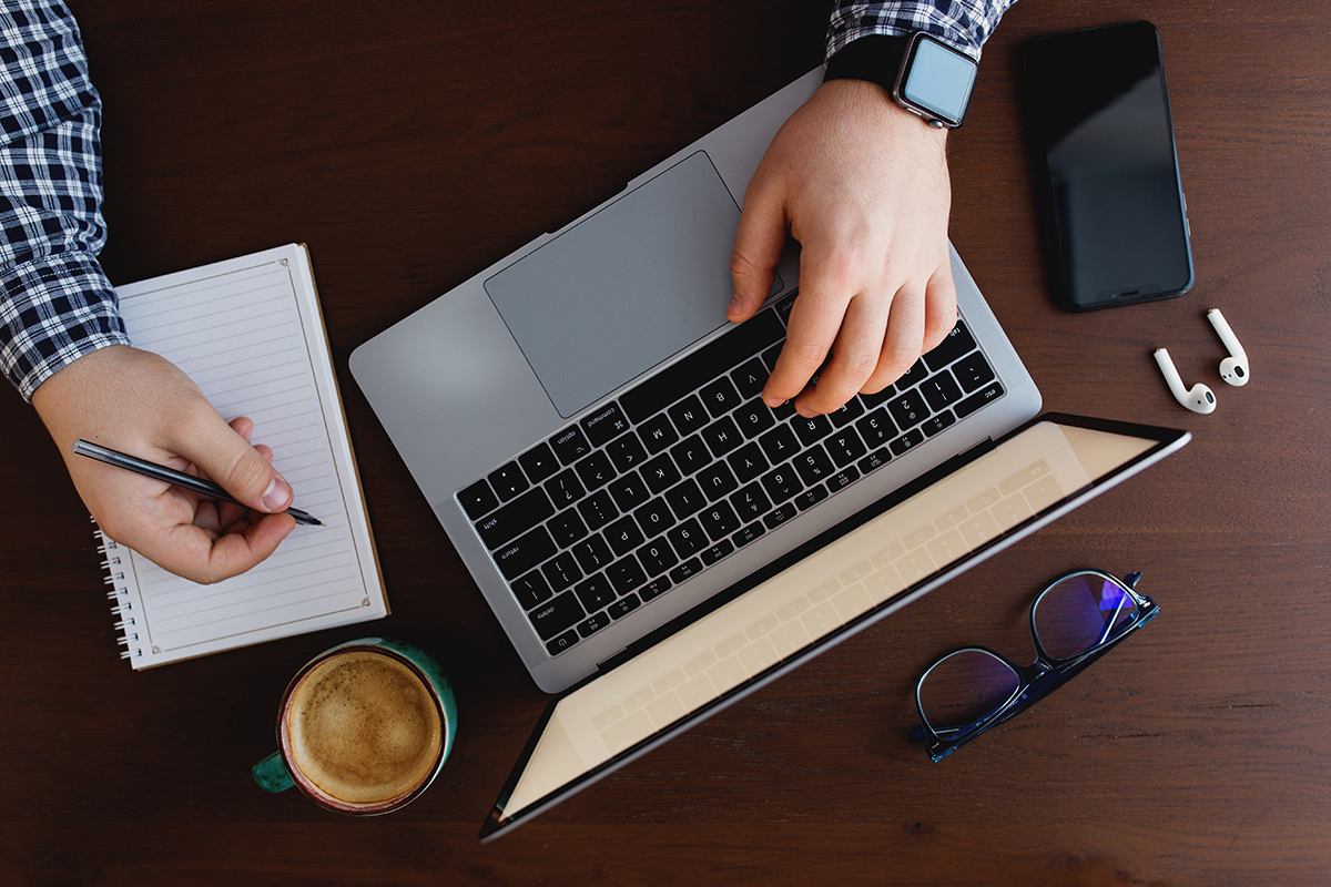 man working from home with laptop