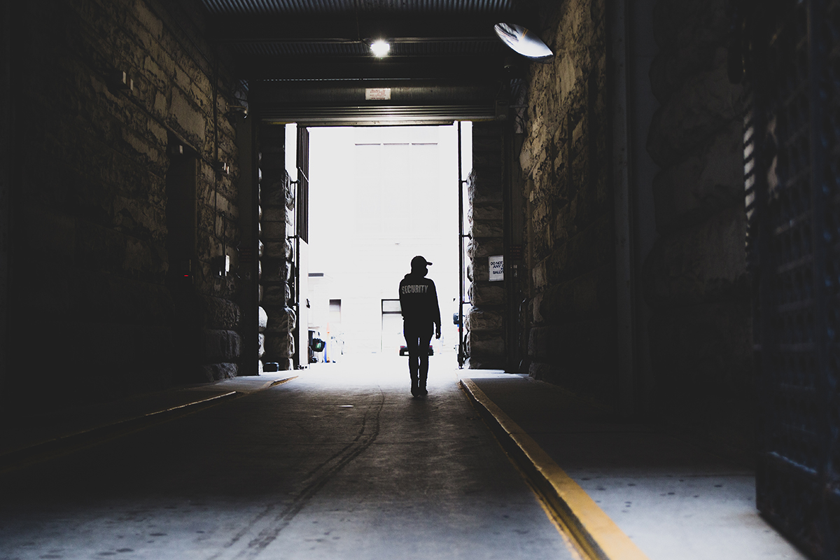 Security Guard patrolling tunnel