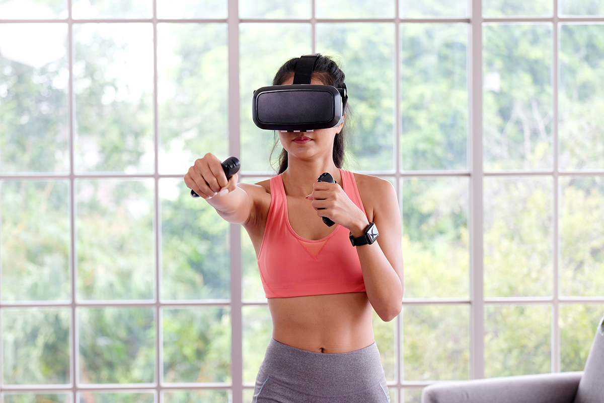 woman gaming for fitness with a VR