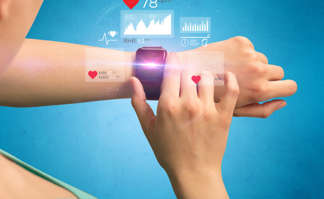 female hand with smartwatch and health applications