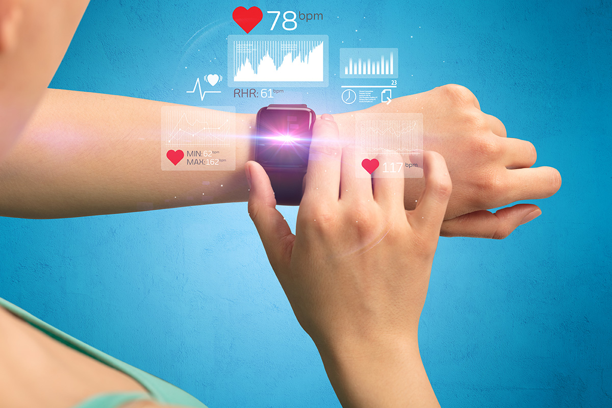 female hand with smartwatch and health applications