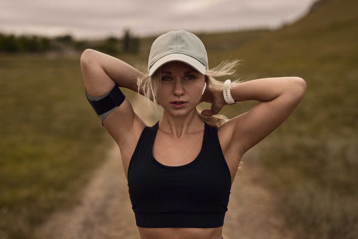 Fit woman with sport watch and cap