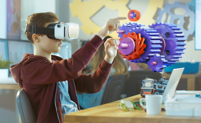 boy in school wearing VR headset