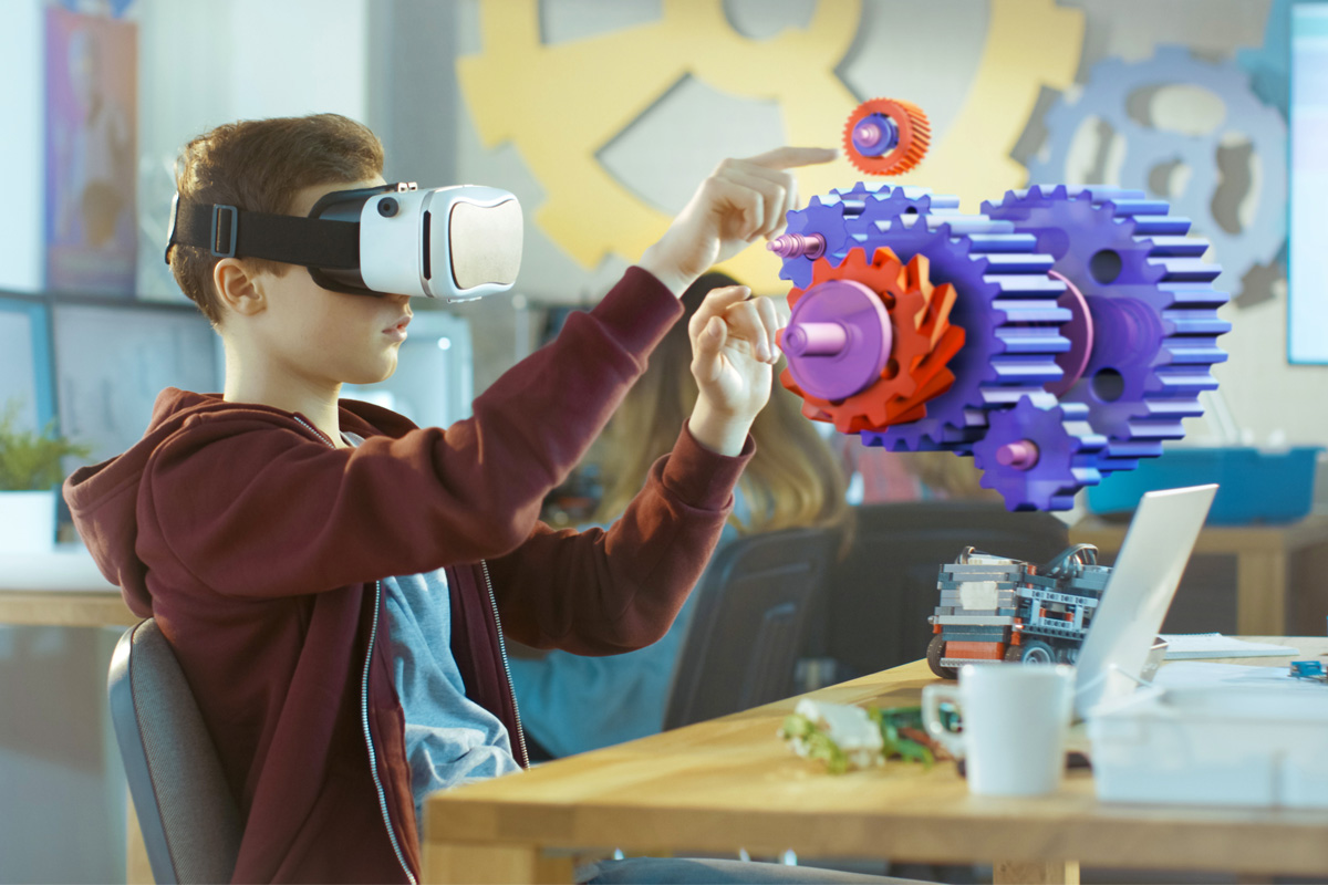 boy in school wearing VR headset