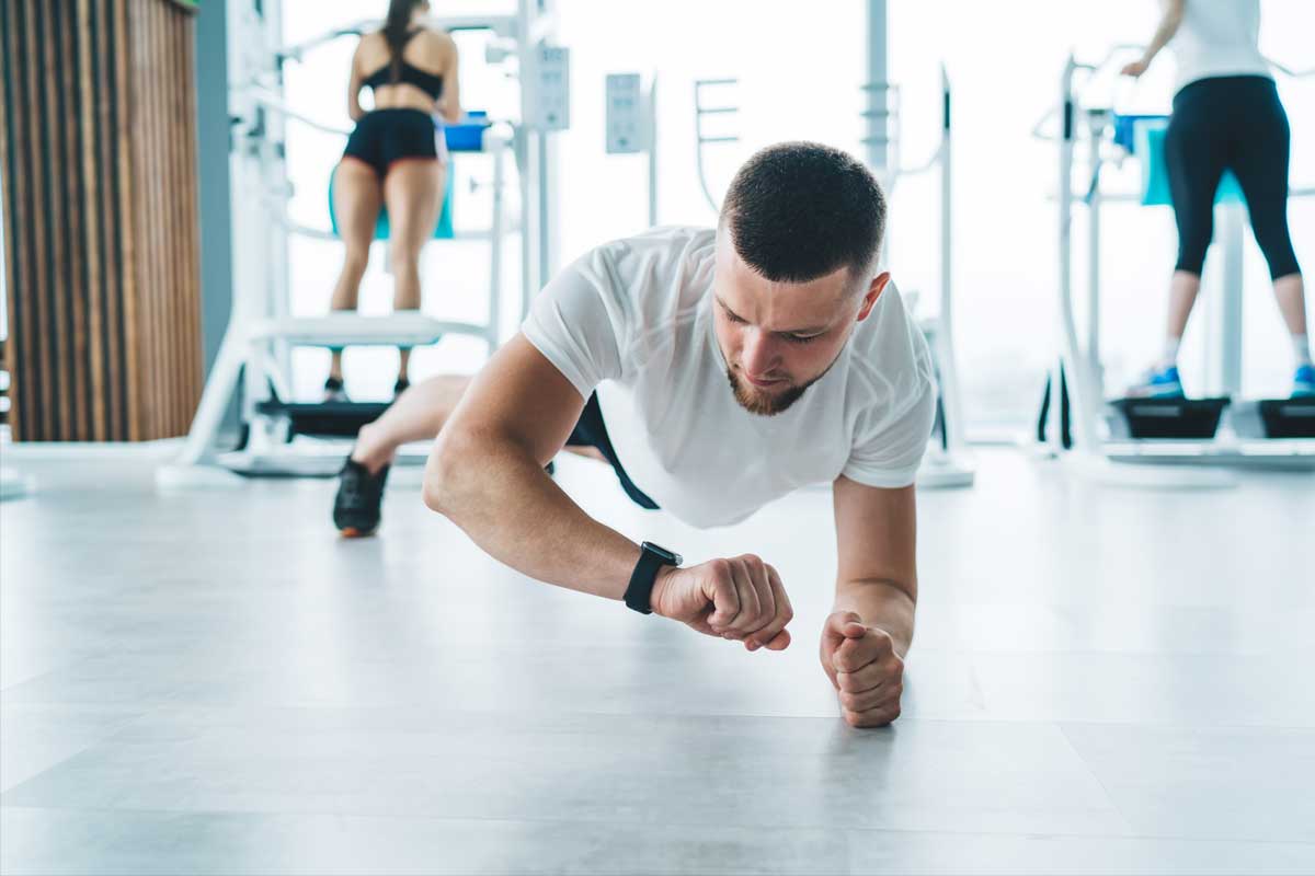 Man at gym with fitness tracker