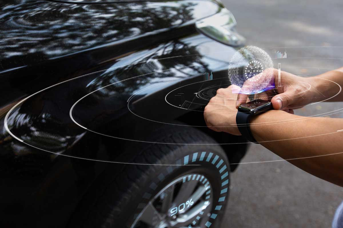Man using smart watch to check car air pressure
