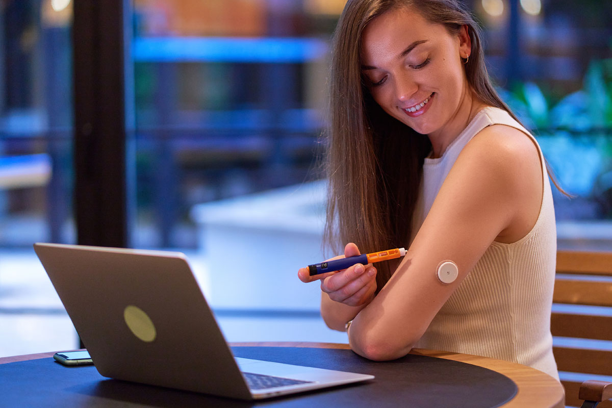 Woman using insulin pen