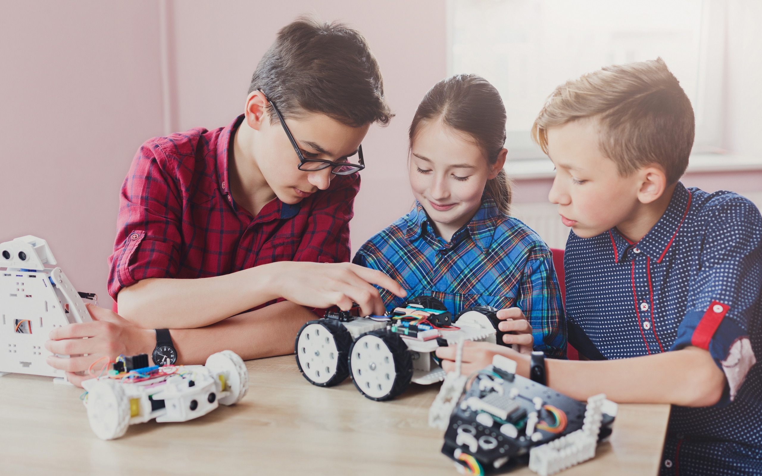 Stem education. Kids creating robots at school