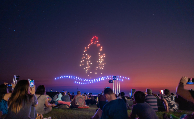 Drone light show at dusk