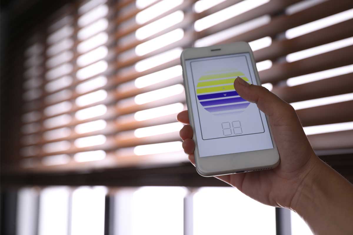 Woman using smart blinds