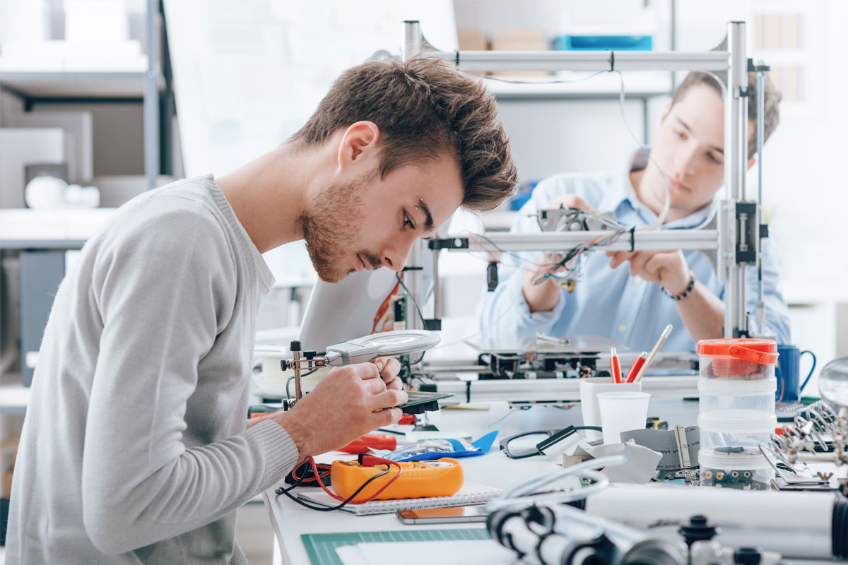 Engineering students working together in a lab