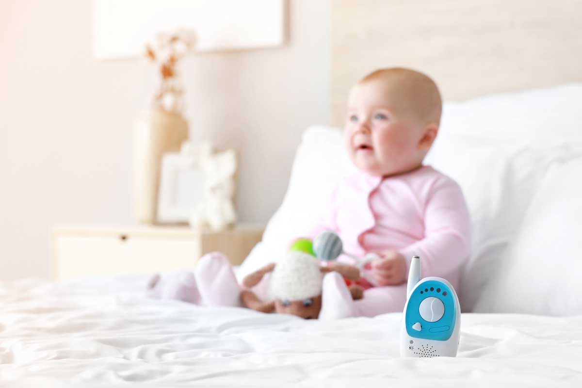 How-AI-and-IoT-Is-Revolutionizing-Childcare--Baby-on-Bed-with-monitor