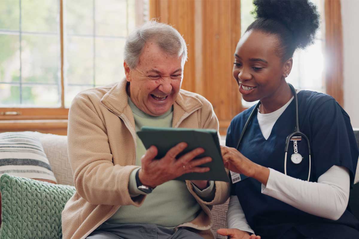 Using AI in Nursing Homes for a Better Retirement - Man and nurse with tablet